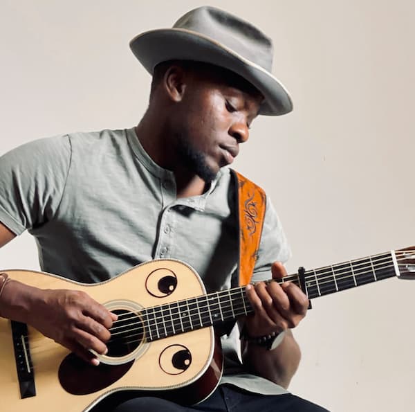 African American man plays guitar